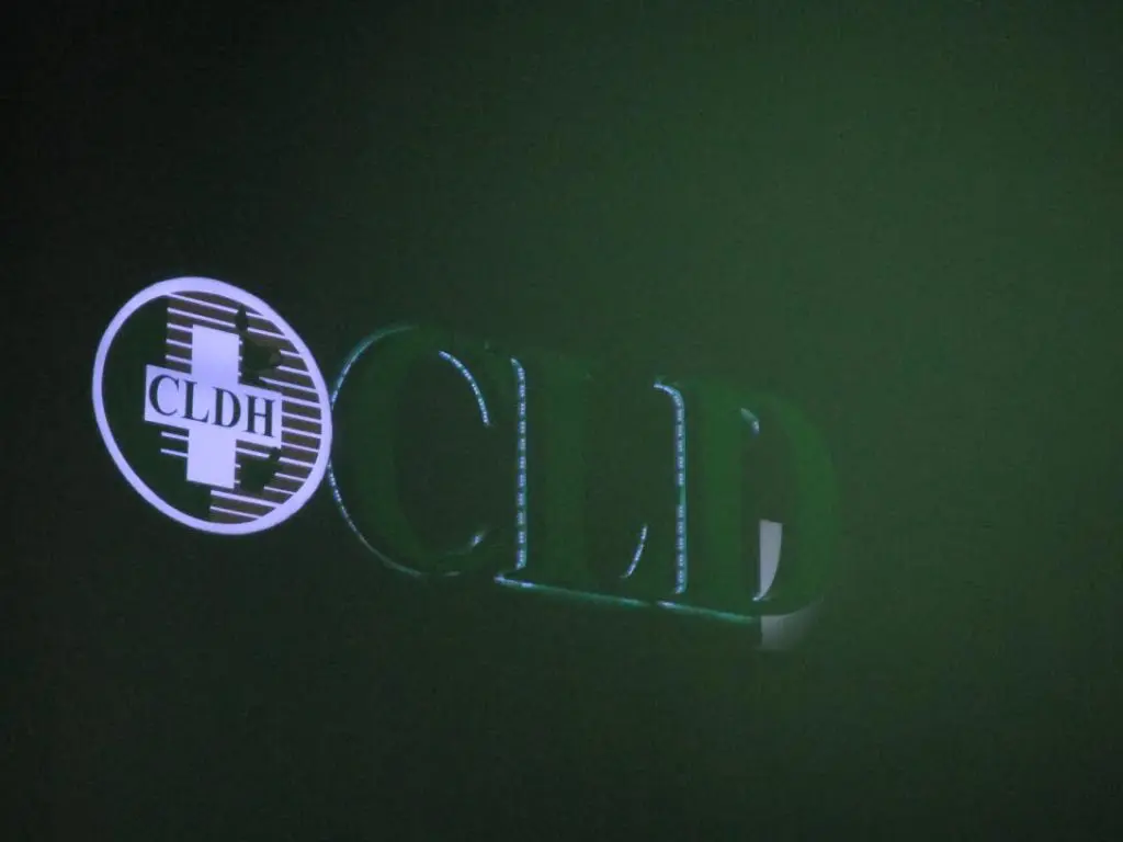 Indoor illuminated signage for CLDH with circular logo, greenish-lit in Makati at night, by M&G Global Ads.