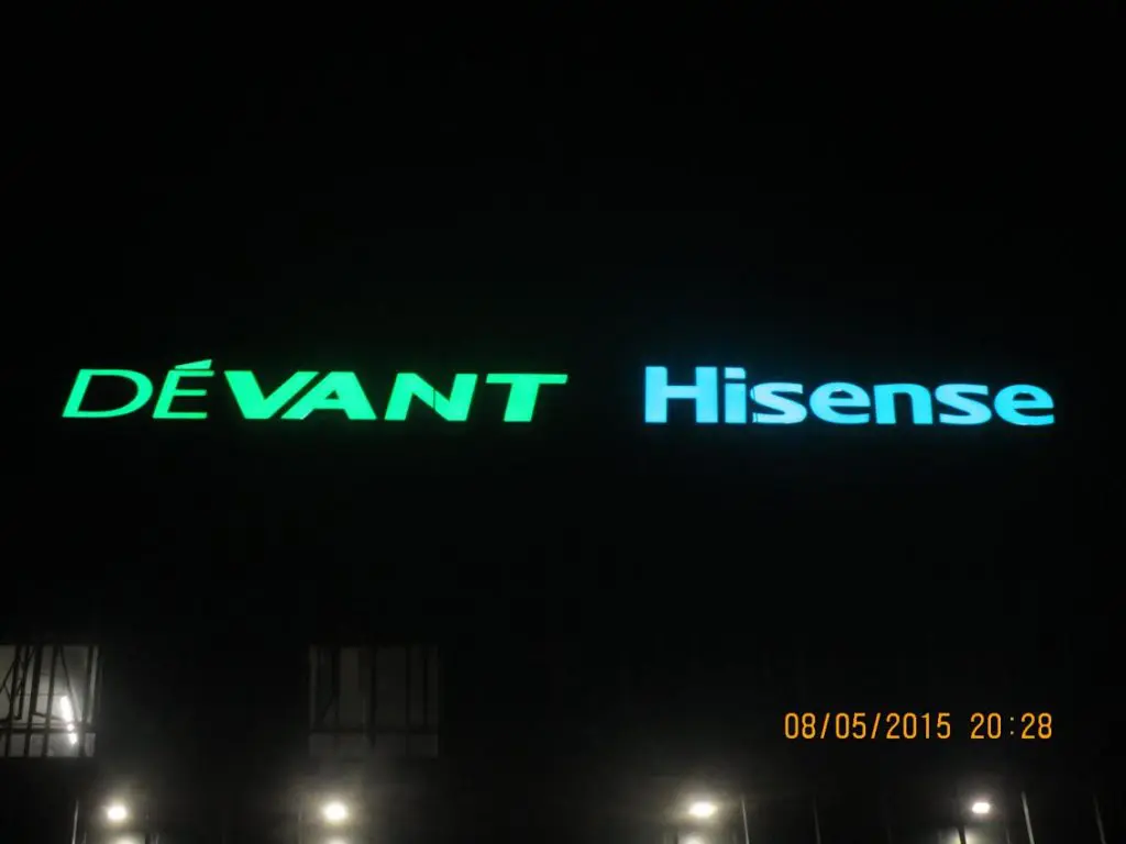 LED signage for DEVANT and Hisense on a dark building in Makati at night, timestamped 08/05/2015 by M&G Global Ads.