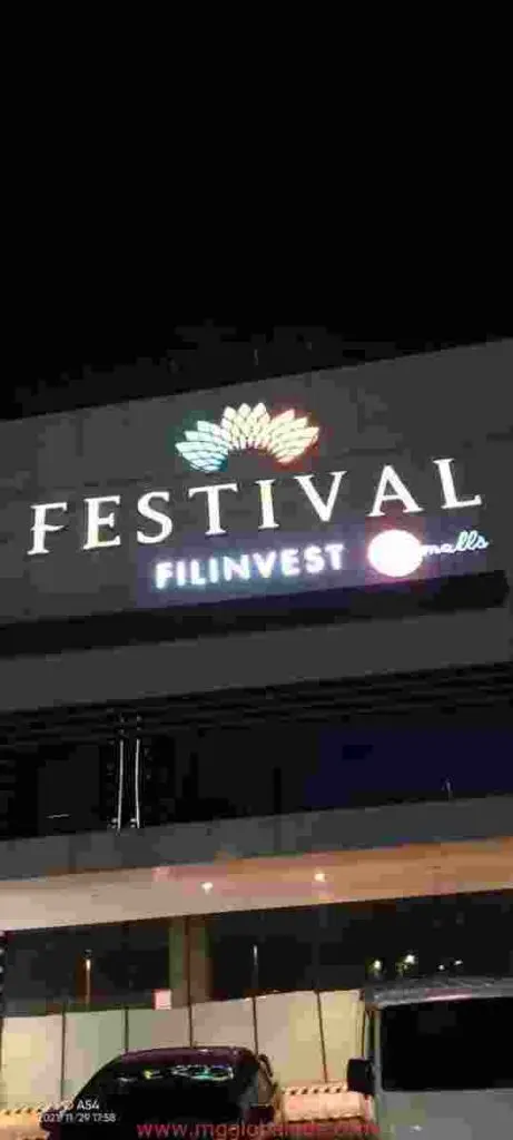 LED signage for Festival Filinvest Malls with lotus logo at night, cars below, Ortigas location by M&G Global Ads.