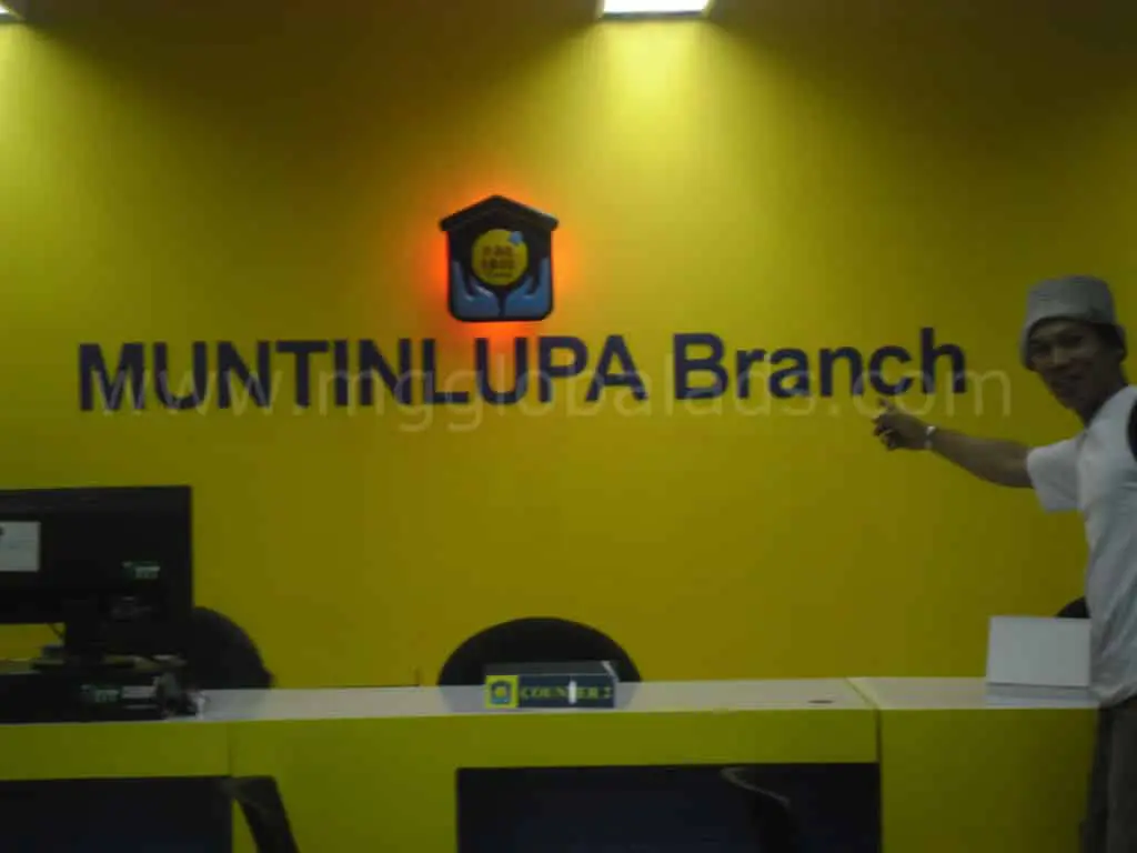 Building signage for MUNTINLUPA Branch above a reception desk in Metro Manila by M&G Global Ads.