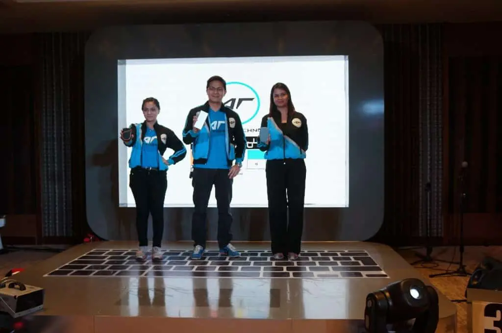 LED stage signage display with three presenters in blue and black jackets at Makati event, by M&G Global Ads.