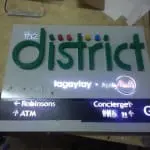 Wayfinding signage for the District by M&G Global Ads in Makati, with green letters, evacuation plan, icons, and directions.