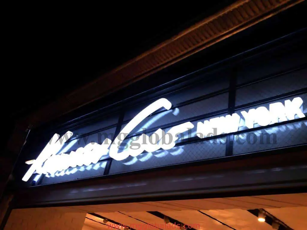 LED signage for Henri Bendel New York in Makati glows with bright white letters at night by M&G Global Ads.