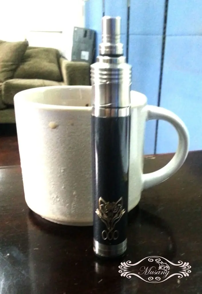 Sleek acrylic signage for vape shop with silver and black vape in Makati, brown couch, blue cabinet by M&G Global Ads.