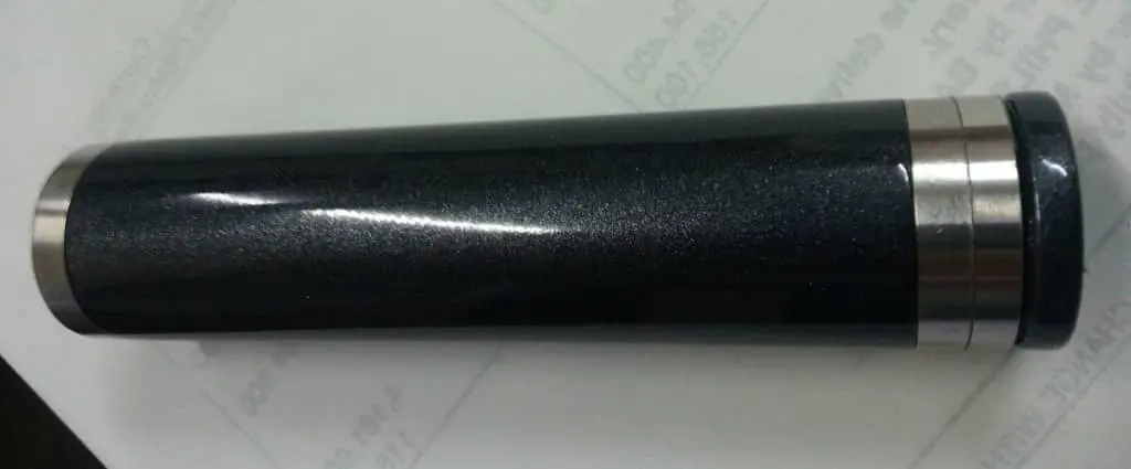 Acrylic building signage sample for client in Makati, black cylindrical object with silver bands by M&G Global Ads.