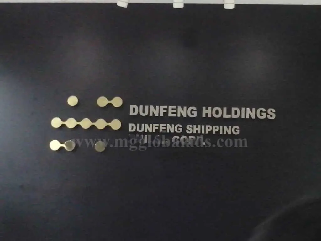 Building signage for Dunfeng Holdings and Dunfeng Shipping in Ortigas, gold and silver style, by M&G Global Ads.