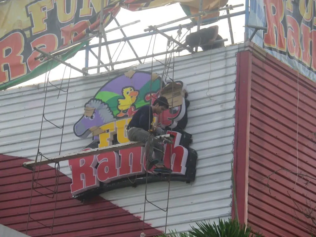 LED signage installation for Fun Ranch at Ortigas with cartoon animals, done by a skilled worker—by M&G Global Ads.