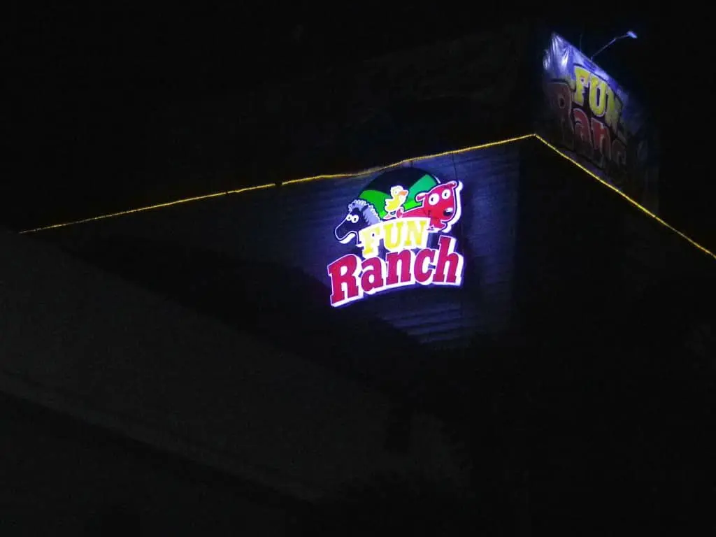 Fun Ranch outdoor building signage in Ortigas with cartoon animal faces and yellow lights at night by M&G Global Ads.