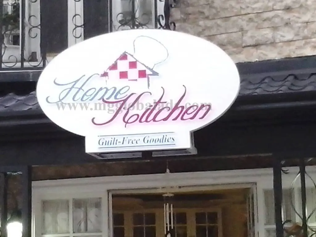 Home Kitchen oval building signage, red checkered roof logo, Guilt-Free Goodies slogan in Makati by M&G Global Ads.