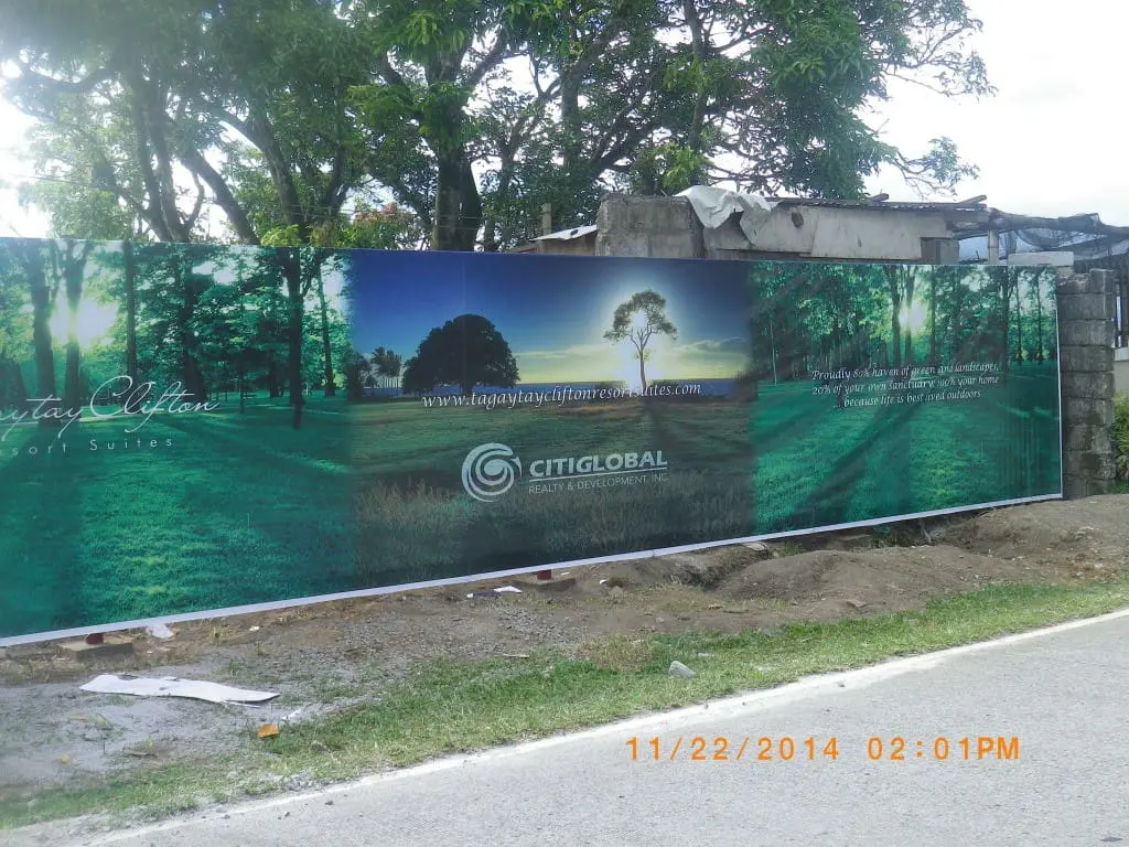 Citiglobal Realty billboard signage at a road and construction site in Quezon City, lush park image, by M&G Global Ads.