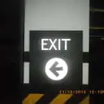 Indoor EXIT directional signage with left arrow in Makati, black and white color, date stamp, by M&G Global Ads.
