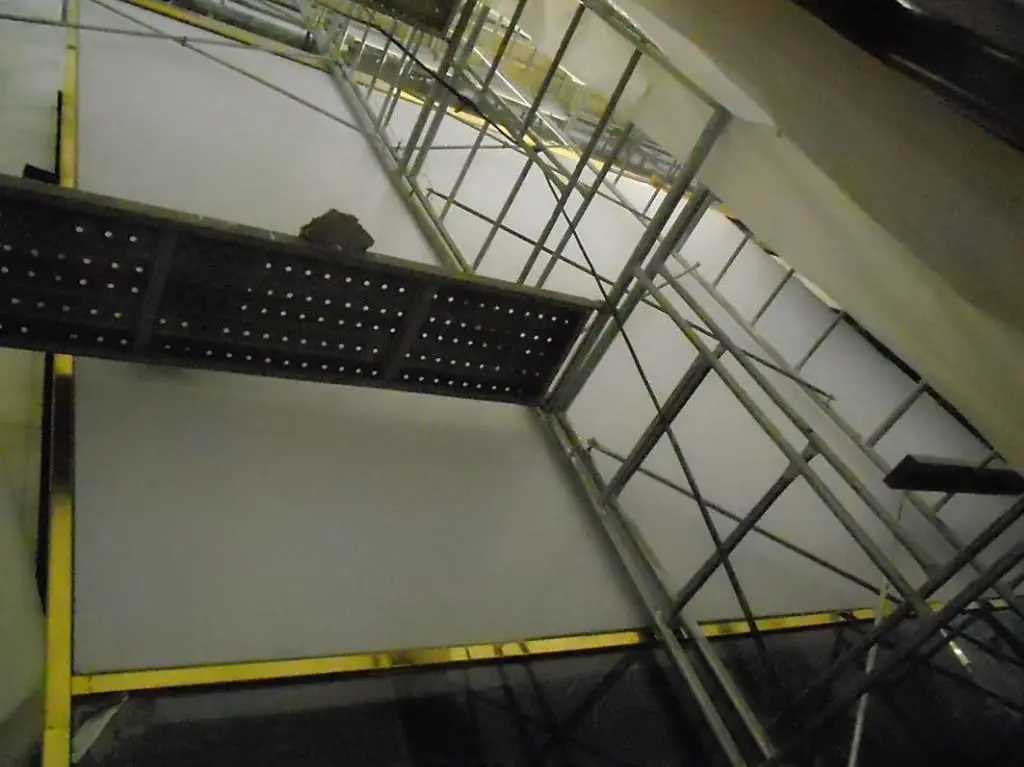 Acrylic signage installation with metal scaffolding inside a building in Ortigas by M&G Global Ads.