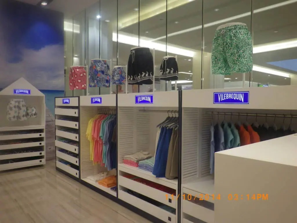 Acrylic signage for Vilebrequin in Makati store with colorful swim trunks, modern fixtures, beach wall—by M&G Global Ads.