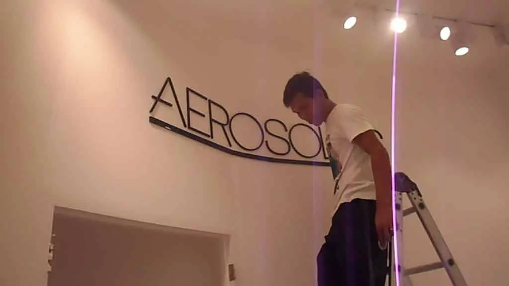 Building signage installation for AEROSOL client in Makati, large letters under bright lights by M&G Global Ads.