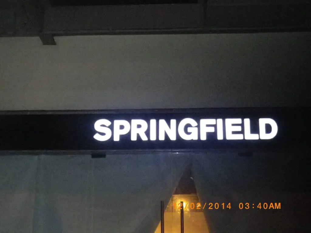 Acrylic indoor signage for SPRINGFIELD with illuminated white letters, timestamped, in Quezon City by M&G Global Ads.