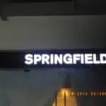 Acrylic indoor signage for SPRINGFIELD with illuminated white letters, timestamped, in Quezon City by M&G Global Ads.