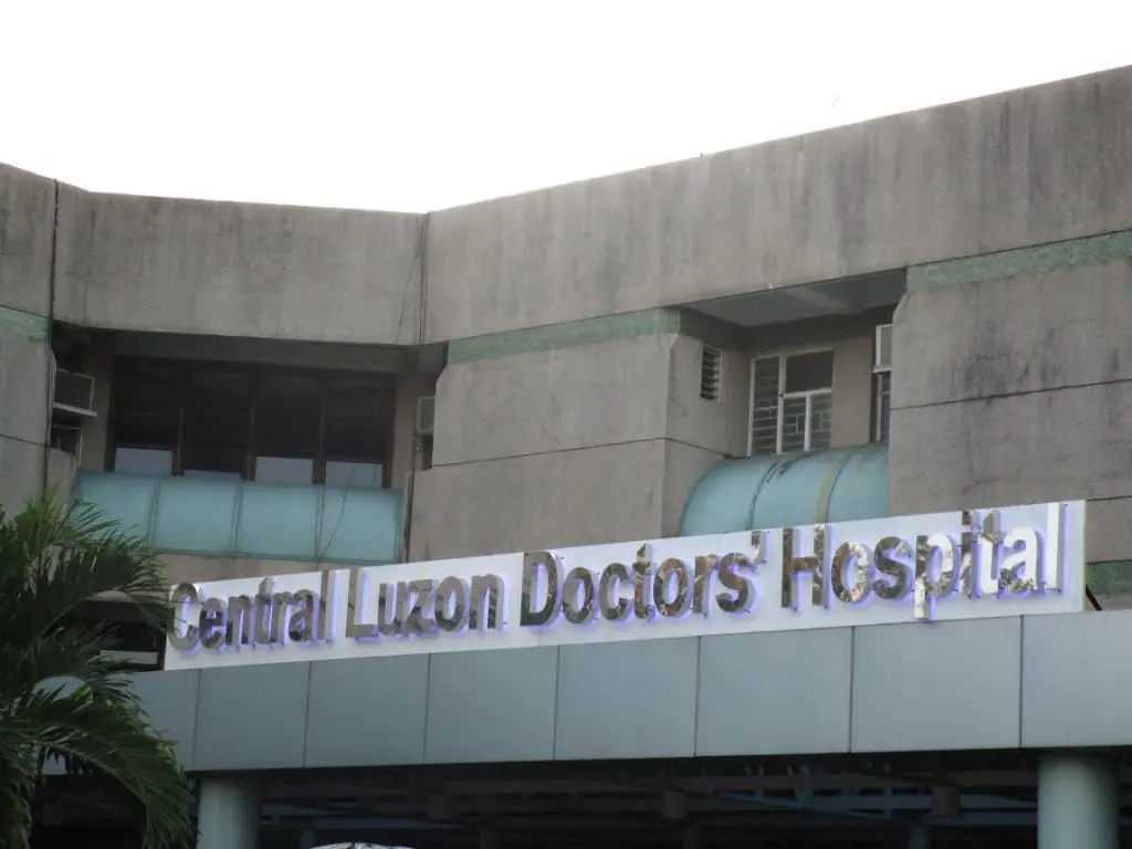Hospital outdoor signage for Central Luzon Doctors Hospital, Quezon City location, by M&G Global Ads. Palm tree on left.