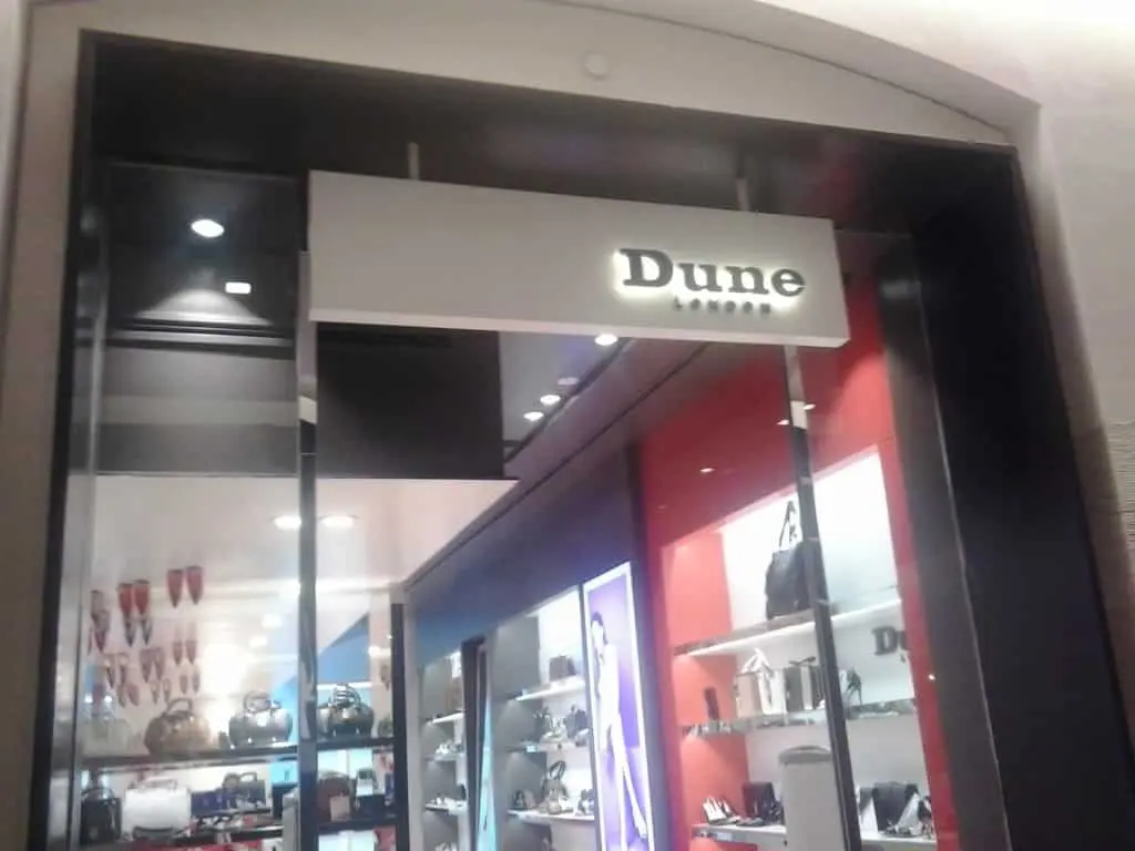 Dune London storefront with illuminated acrylic signage in Makati, displaying handbags and accessories by M&G Global Ads.