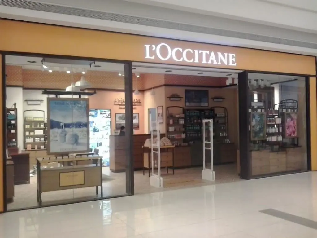 L’OCCITANE lighted building signage at a Makati mall storefront with visible products and shelves inside by M&G Global Ads.