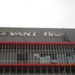 DEVANT Hise outdoor building signage installation in Makati, grey facade with red and silver accents by M&G Global Ads.