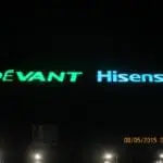 LED building signage for DÉVANT and Hisense in blue and green, night view, Makati location, by M&G Global Ads.
