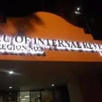 Metallic office signage Bureau of Internal Revenue, Region No. 8 at night in Makati with glare on letters by M&G Global Ads.