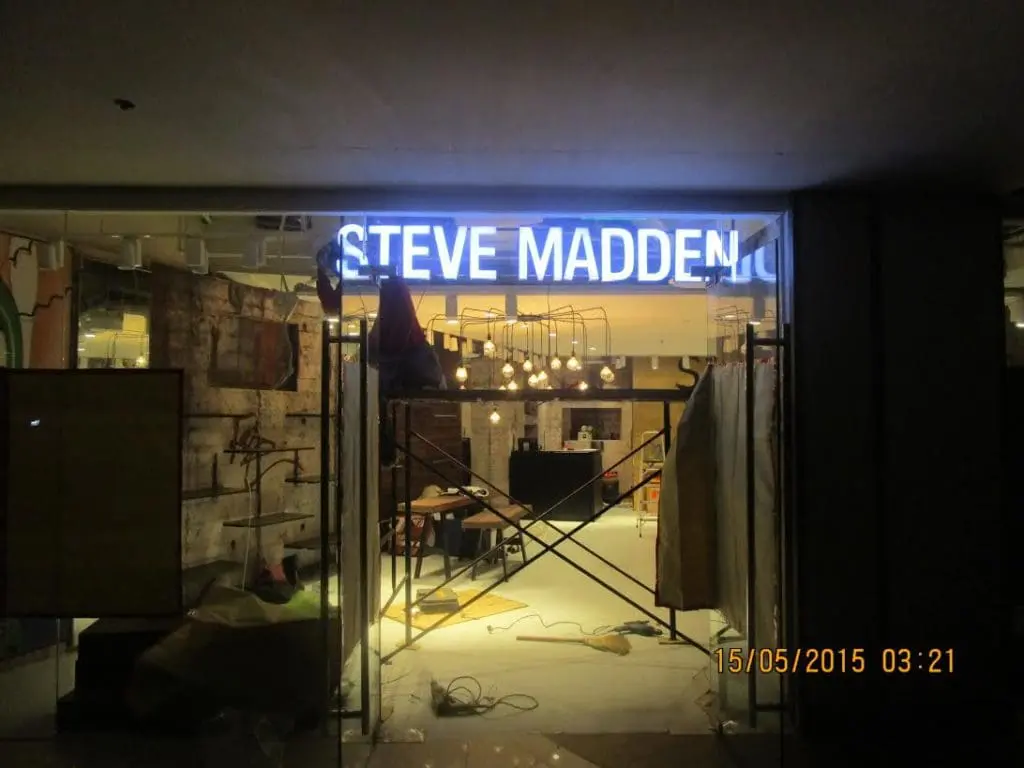 Steve Madden illuminated metallic signage installation in progress at a Makati store by M&G Global Ads.