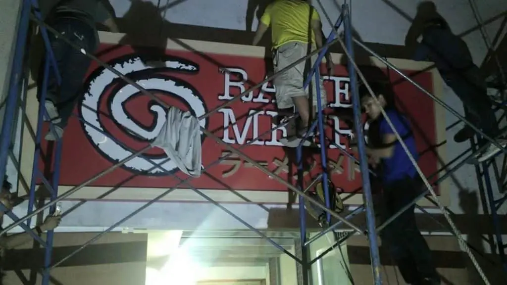 Outdoor restaurant signage installation for Ramen Makoto in Quezon City at night, red sign with English and Japanese by M&G Global Ads.