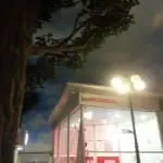 Metallic Honda dealership signage above entrance in Quezon City, with vertical banner at left, by M&G Global Ads.