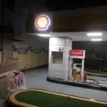 Shell gas station with LED signage and V-Power pumps at night in Makati, under construction. Signage by M&G Global Ads.
