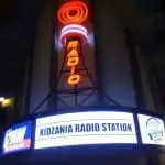 KidZania Radio Station neon signage in Makati, with large radio tower and marquee at night by M&G Global Ads.