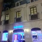 Via Mare neon metallic signage on classic building facade, Coca-Cola vending machine, Makati exterior at night by M&G Global Ads.