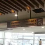 Wooden ceiling signage for mall in Mandaluyong, arrows to Supermarket, Shops, Shaw Blvd Exit, Foodarama by M&G Global Ads.
