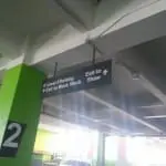 Ceiling wayfinding indoor signage for Level 3 Parking and exits at Mandaluyong, with green wall, by M&G Global Ads.