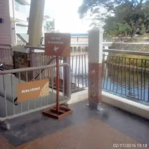 Metallic area closed sign and directional boardwalk signage by river walkway in Makati, Metro Manila by M&G Global Ads.