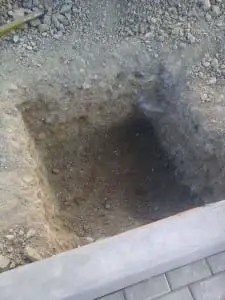 Billboard signage under construction in Quezon City with scaffolding, tarp, and buildings nearby by M&G Global Ads.