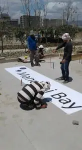 Acrylic outdoor printed banner installation near buildings in Quezon City, durable signage materials by M&G Global Ads.