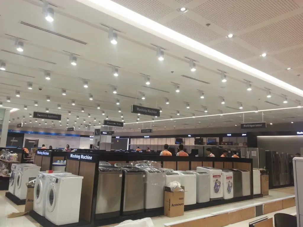 Skyworth LED signage on empty display shelves in a bright electronics store in Quezon City by M&G Global Ads.