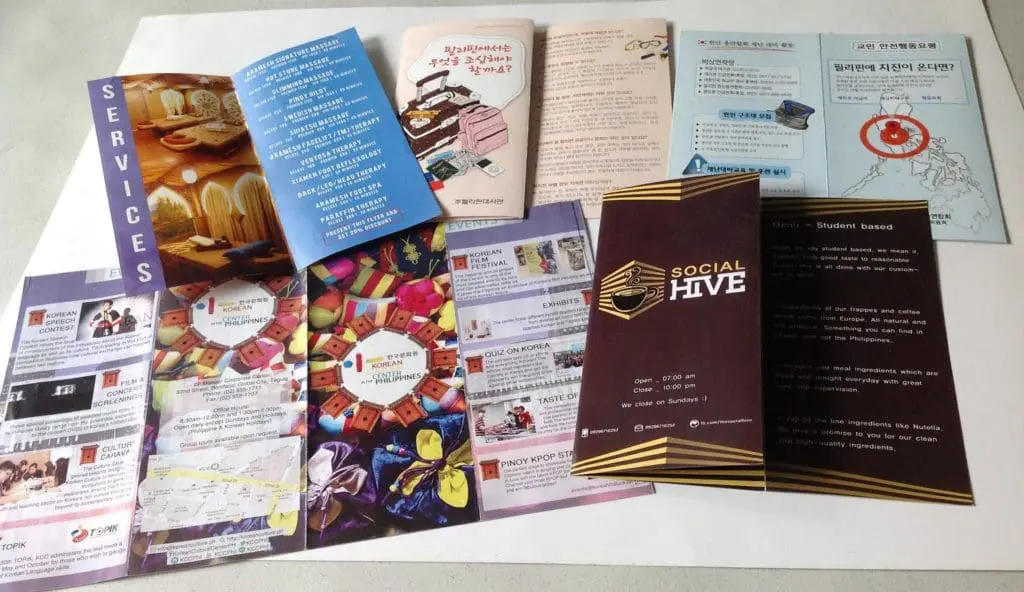 Colorful indoor signage pamphlets and brochures in English and Korean, Quezon City location, by M&G Global Ads.