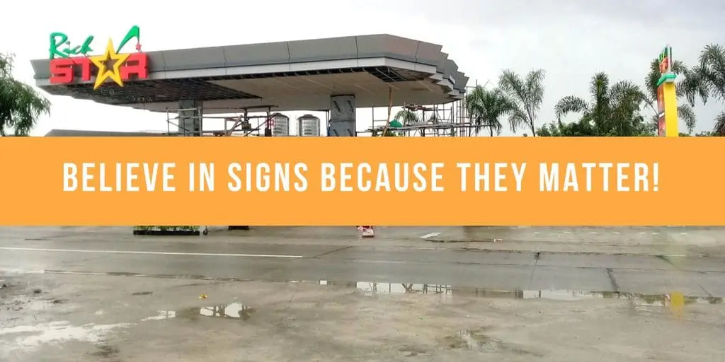 Metal sign fabrication at a gas station, orange motivational banner, Makati signage project by M&G Global Ads.