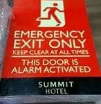 Emergency exit hotel signage, Summit Hotel, Makati; red and white metal sign for safety compliance by M&G Global Ads.