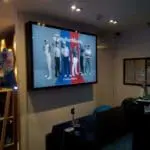 LED signage for TaylorMade ad featuring six golfers, #TEAMTAYLORMADE, in a Makati lobby by M&G Global Ads.