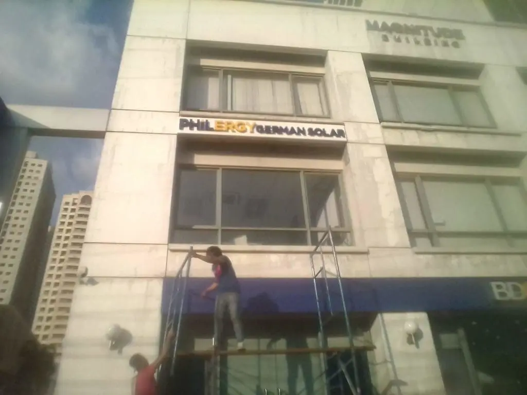 Acrylic signage for PHILERGY GERMAN SOLAR client installed on building facade in Makati, Metro Manila by M&G Global Ads.