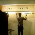 Metallic OLEG CASSINI store signage installation in Makati with glass shelf adjustment by M&G Global Ads.