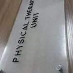 Indoor metallic signage for Physical Therapy Unit, Quezon City, with black text and blue logo on wood by M&G Global Ads.
