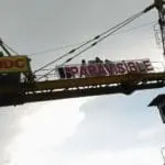 Outdoor crane signage for SMDC and PARAVISIBLE in Makati with banners, cloudy sky view by M&G Global Ads.