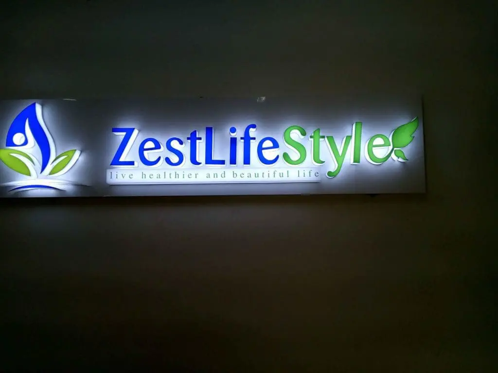 Indoor metallic signage for ZestLifeStyle with blue-green leaf logo in Makati, modern design by M&G Global Ads.