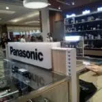 Panasonic acrylic signage at retail store with display counter, glass shelves in Makati by M&G Global Ads.