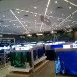 LED signage for Philips, Sony, and LG in an electronics store in Makati with a plant wall. By M&G Global Ads.