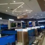 Bright indoor LED signage in an electronics store with TVs and appliances, Quezon City location by M&G Global Ads.